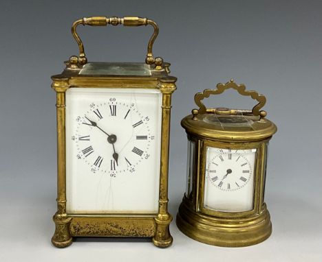 A French brass carriage clock timepiece, white dial, Roman numerals, four glass brass case, 14cm high, 7.5cm wide, 6.2cm dep;