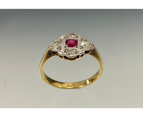 An Art Deco diamond and ruby ring, central round cut vibrant red ruby surrounded by four old brilliant cut diamonds, 18ct gol