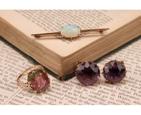 A 9ct gold bar brooch, set with a single polished oval opal cabochon, marked 9ct, 5.5cm wide, 4.4g; a 9ct rose gold ring, set