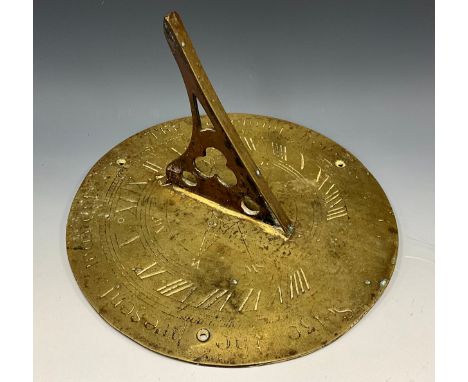 A Gothic Revival brass sundial, inscribed Seize the Present Moment, and The Evening Hour, 25cm diam, early 20th century