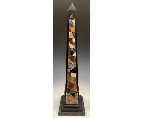 A granite obelisk, the façade inlaid with malachite, onyx, and other precious stones, stepped square base, 64.5cm high overal