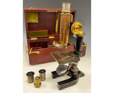 A late 19th century monocular microscope by C. Reichert Wein No 12014, brass and black lacquered body, three rotating len hol