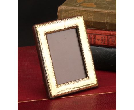 A Continental gold rectangular easel photograph frame, gadrooned borders, 8.5cm high, marked 333, 20th century