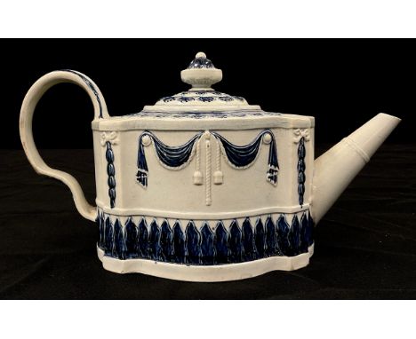 A Hawley blue and white pearlware teapot, in the commode shape, moulded in relief with linen swags and stiff leaves,13cm high