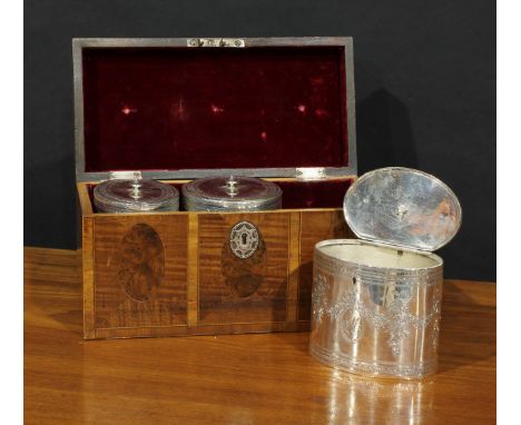 A set of three George III silver oval tea caddies, bright-cut engraved in the Neo-Classical taste with ribbon-tied swags and 