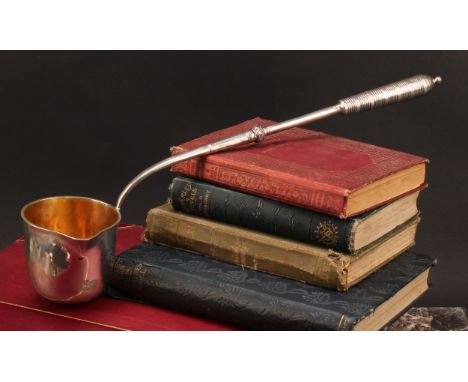 A Continental silver punch ladle, probably German, deep flared bowl with gilt interior, ribbed grip, 37cm long, 19th century