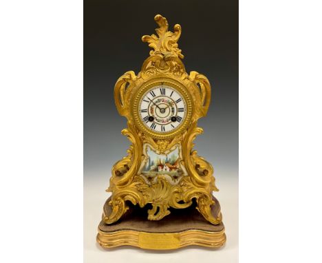 A 19th century French Ormolu and porcelain mantel clock, floral dial, Roman numerals, above landscape panel, scrolling case, 