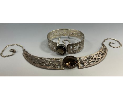 A Scottish Celtic Dragon silver and smoky brown quartz necklace and cuff bracelet, Celtic Arts Scotland, Edinburgh 1989, boxe