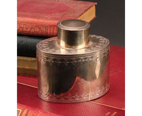A George III silver oval tea caddy, bright-cut engraved borders, push-fitting cover, 8.5cm high, Thomas Hayter, London 1808, 