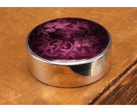 A Swiss Art Deco period silver and enamel circular table snuff box, the push-fitting cover decorated in tones of purple with 