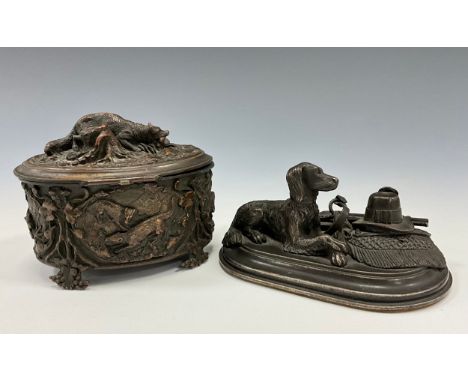 A bronze animalier figure group Awaiting the Hunt with recumbent hound dog, a rifle, hat, belt and sword to his side, oval pl