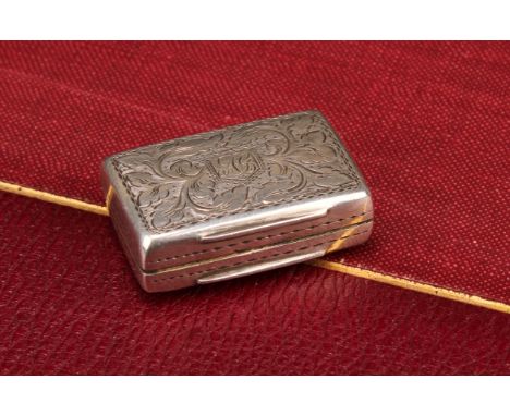 An early Victorian silver rounded rectangular vinaigrette, bright-cut engraved with scrolling leaves and outlined with wriggl