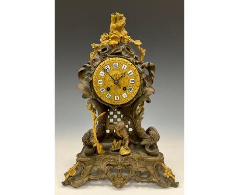 A early 19th century French bronze and ormolu mantel clock, twin holes, mechanical movement, enamel Roman numerals, in the Ro