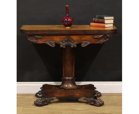 A William IV rosewood card table, hinged top enclosing a baize lined playing surface, tapered pillar, lotus socle, lion paw f