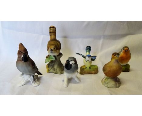 A Crown Staffordshire figure of a Robin designed by J T Jones, another of a Tomtit, two Goebel bird ornaments, an Aynsley fig
