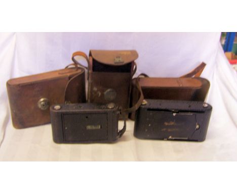 A Kodak folding pocket Camera, No. 1A and two other Kodak folding camera's. 