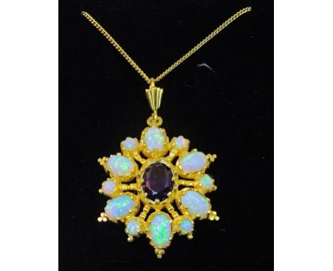 A silver gilt Pendant with centre amethyst surrounded by opals.  