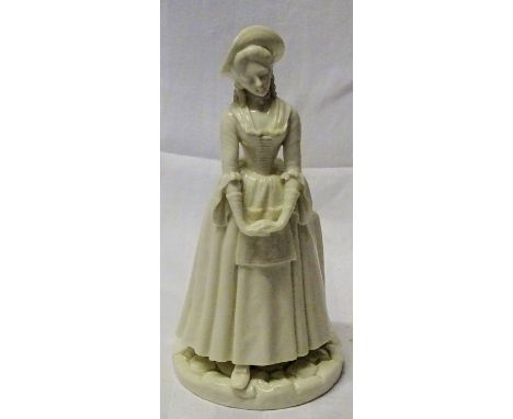A Royal Worcester white glazed standing figure of a lady.  8" (20cms) high.