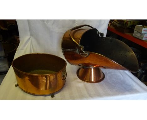 A 19th century copper Coal Helmet with swing handle and a copper oval two handled planter. 