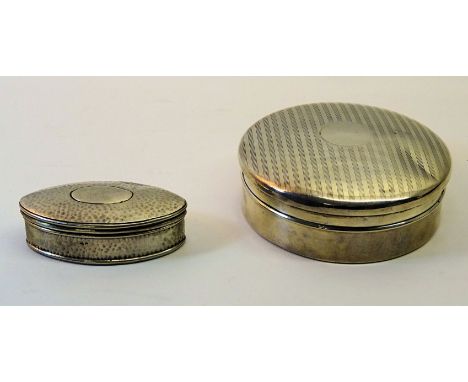 An silver circular Powder Bowl with engine turned mirror lined cover and a hammered silver navette shape dressing table box. 