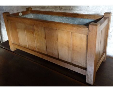 An oblong oak Planter by Lister & Co with metal liner.  2' (61cms) wide. 