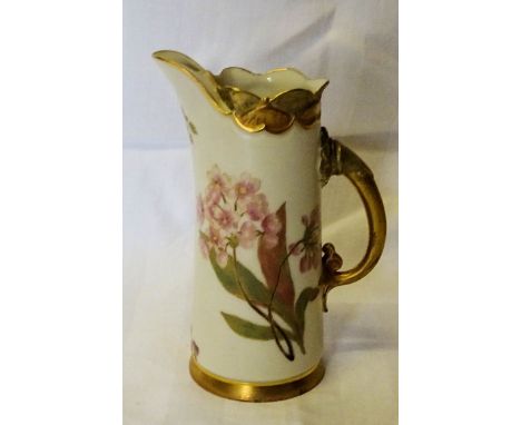 A late Victorian Royal Worcester Jug painted in pink, orange and gilt with sprays of flowers and leaves, with a gilded handle