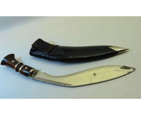 A Gurkha Kukri in scabbard.