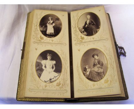 A Victorian leather bound Photograph Album and contents of approximately 80 portrait photographs of ladies with lithograph pa