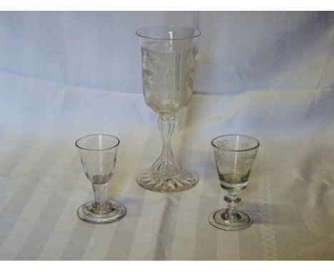 An early 19th Century Cordial Glass with tied ribbon decoration, on a cushion knop stem and folded foot, another with air twi
