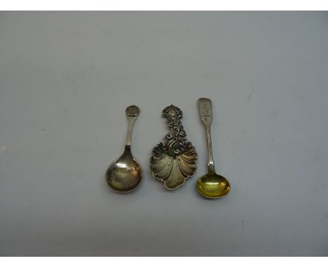 A Victorian silver Caddy Spoon with leaf shape bowl and floral embossed stem, Sheffield 1854, maker Martin Hall & Co, another