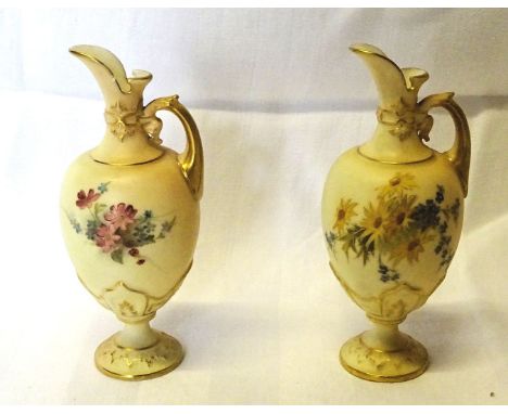 A pair of late Victorian Royal Worcester small Ewers painted with floral sprays on a blush ivory ground, date code for 1898. 