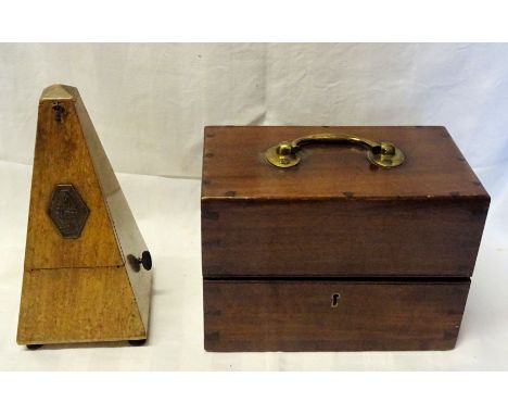A Maelzel Metronome and a mahogany instrument box with brass handle.