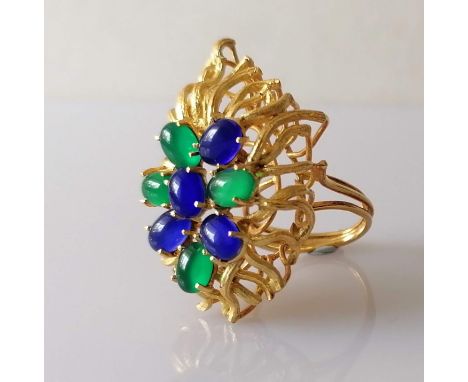 An 18ct yellow gold flame-shape dress ring with elaborate openwork and oval cabochon decoration, size N, 47 x 30mm, unmarked,