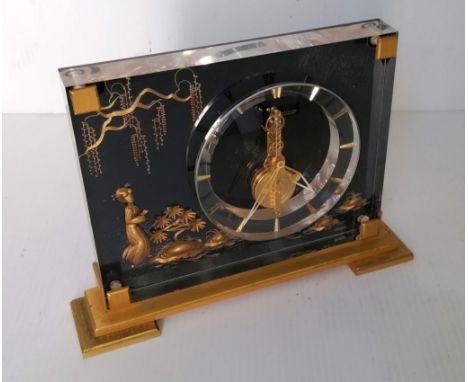 A Jaeger-LeCoultre Marina mantel clock, visible eight day movement, the clear dial with gilt dagger numerals, contained withi