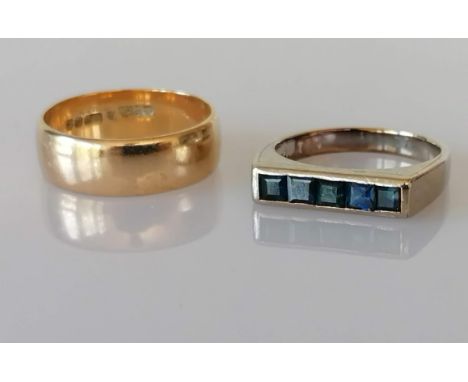 A yellow gold wedding band, 6mm, hallmarked 9ct, and a channel-set sapphire ring on a white gold setting, stamped 375, sizes 