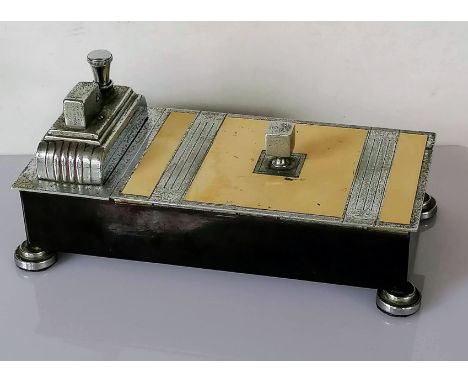 An Art Deco chrome plated and bakelite desk lighter and cigarette box with lined cedar wood interior, stamped 'Ronson Touch-T