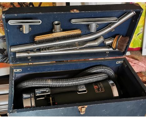 A c. 1939 Vacuum cleaner by Vactric in original box with attachments. British made. Model: Silent 'Q'.&nbsp;