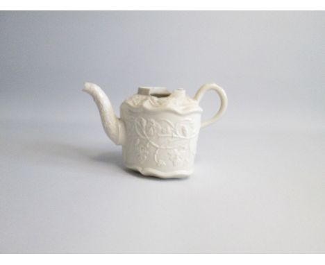 A rare Staffordshire  small saltglaze stoneware, heart shaped teapot, with grape and vine relief decorationDate circa 1755Siz