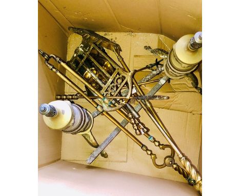 A 19th century brass fire surrounds with other fireplace tools.&nbsp;