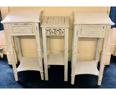 A pair of painted bedside drawers/lamp stands; another similar (3)