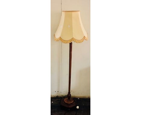 A 20th century mahogany standing lamp