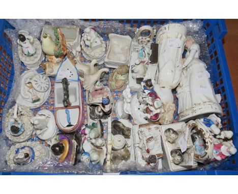 A large group of assorted ceramic fairings, including the lidded box variety. Mostly picked out in colours.&nbsp;