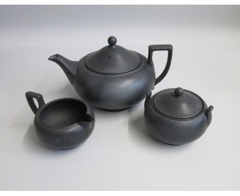 A Wedgwood Black Basalt Tea pot, Milk Jug and Covered Sugar Box   Shape 146Date mid  20th century  WEDGWOOD MADE IN ENGLANDSi