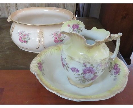 An early twentieth century ceramic foot bath and similar large jug and bowl. Footbath: 56cm wide. (2)Some slight damages. 