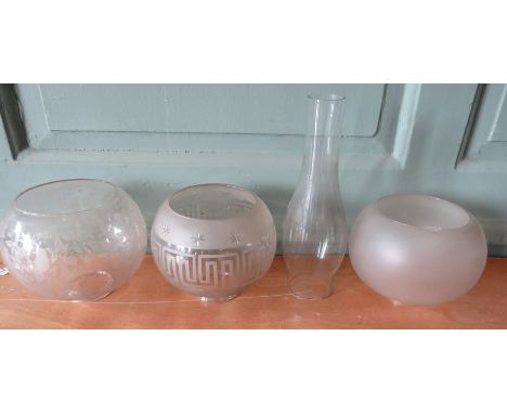 A group of Victorian glass lamp shades from oil lamps and a chimney. (4)