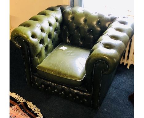 A 20th Century chesterfield type tub button back scrolling armchair. 70cm H x 106cm W