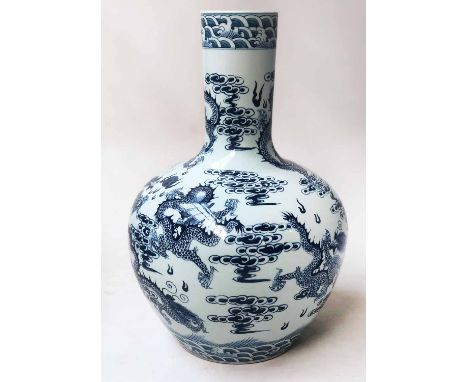 DRAGON VASE, Chinese ceramic blue and white dragon motif of open gourd form, 64cm H.