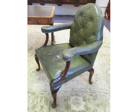 OPEN ARMCHAIR, early 20th century Gothic manner walnut with a buttoned back and green leather upholstery on cabriole supports