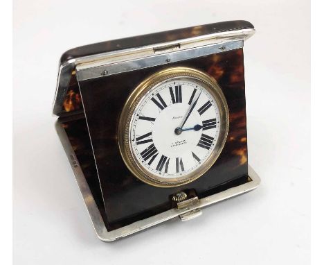 SILVER AND TORTOISESHELL TRAVEL CLOCK, marked London 1930, the time piece marked for 'H. Stokes, Kensington'.
