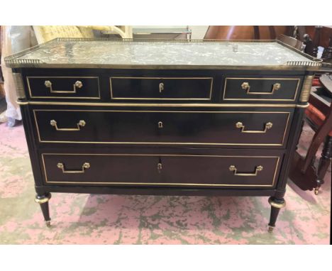 COMMODE, late 18th century French Directoire ebonised of three short over two long drawers with grey marble top and gilt bras